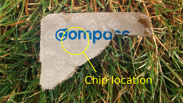 Image of Compass Ticket chopped by lawn mower.