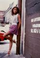 Promo photo of Angel leaning against drainpipe